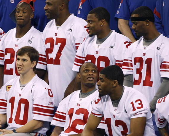 Giants quarterback Manning sits with teammates for a team picture during media day for the NFL Super Bowl XLVI in Indianapolis New York Giants Wear Air Jordans To Superbowl Media Day